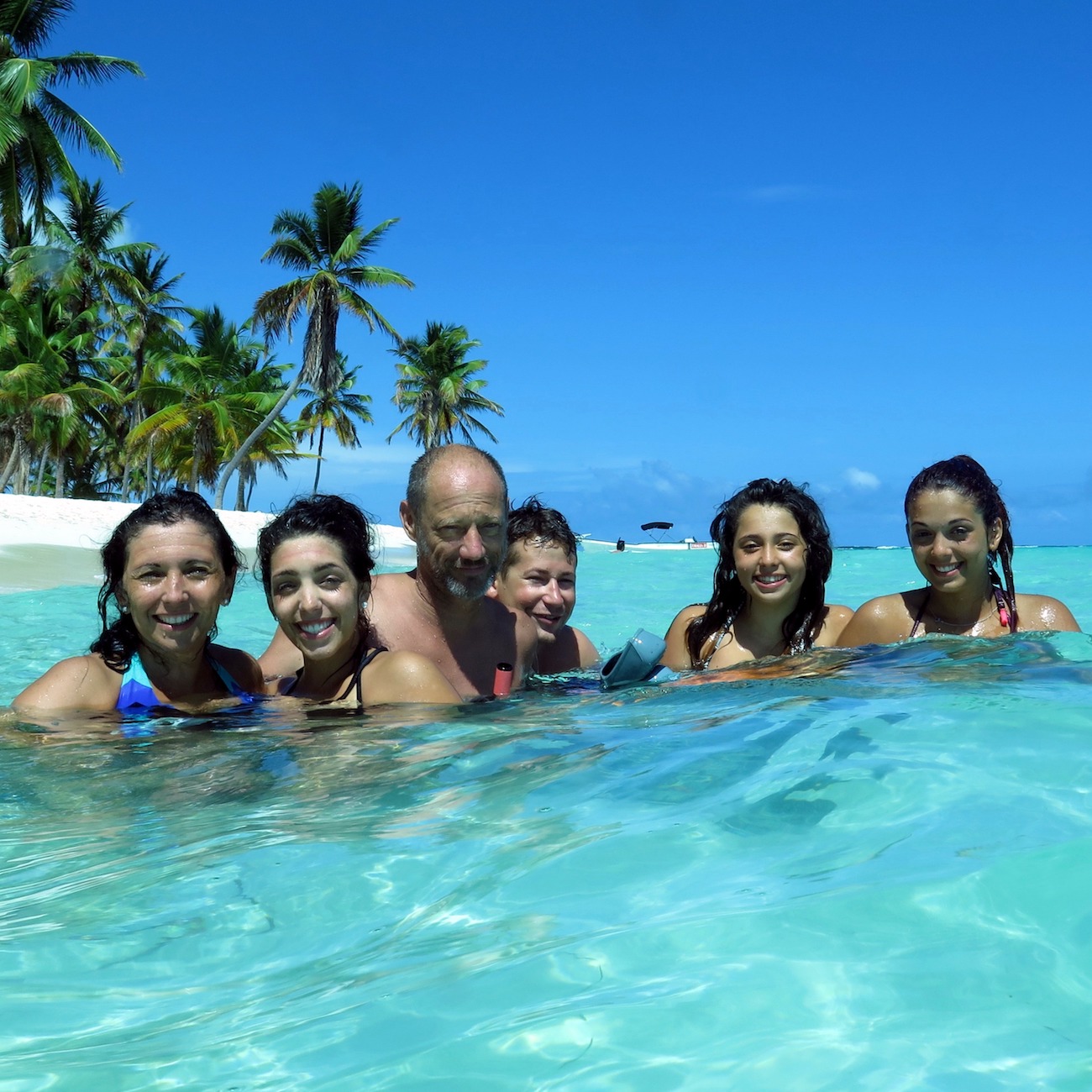 Family swimming at Canto de la Playa, Saona Island